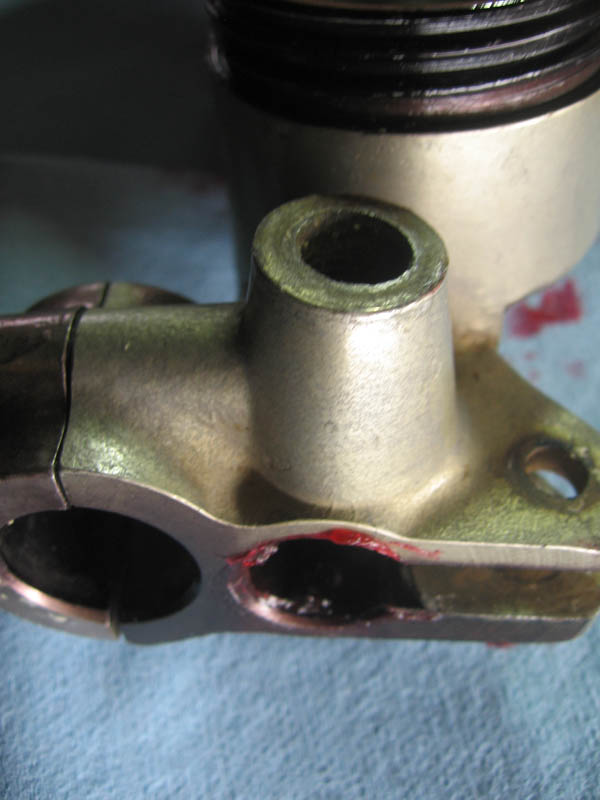 motorcycle tip rebuild brake master cylinder smeared with red rubber grease