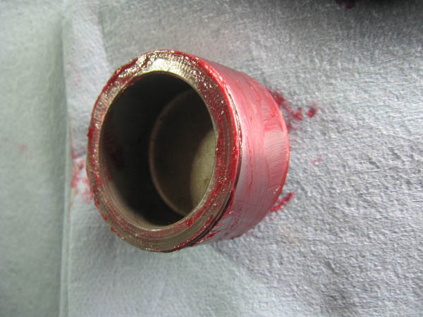 tip rebuild brake caliper piston smeared with red rubber grease